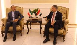 ورود امیرعبداللهیان به بغداد و ادای احترام به شهید سلیمانی و همرزمانش