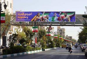 اکران تصاویر افتخارآفرینان کشتی ایران در سطح شهر تهران
