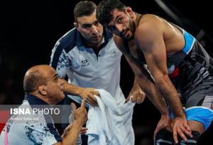 حضور همزمان احسان امینی در کشتی آزاد جوانان و بزرگسالان