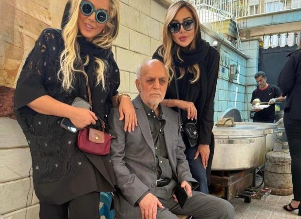عکسی از محمود خوردبین و دخترانش پای دیگ نذری