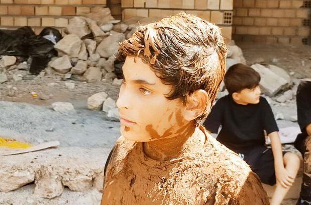 آیین گل‌مالی در هیئت ۷۲ تن دره‌شهر ایلام+تصاویر
